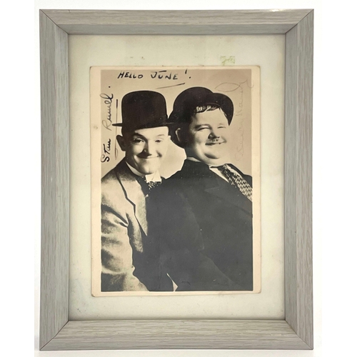 280 - Stan Laurel (1890-1965) and Oliver Hardy (1892-1957), a signed photograph of the duo, inscribed 'Hel... 