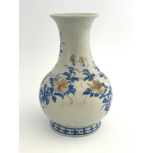 440 - An Oriental porcelain vase, baluster form, painted with stylised chrysanthemums, 31cm high