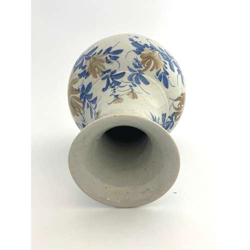 440 - An Oriental porcelain vase, baluster form, painted with stylised chrysanthemums, 31cm high