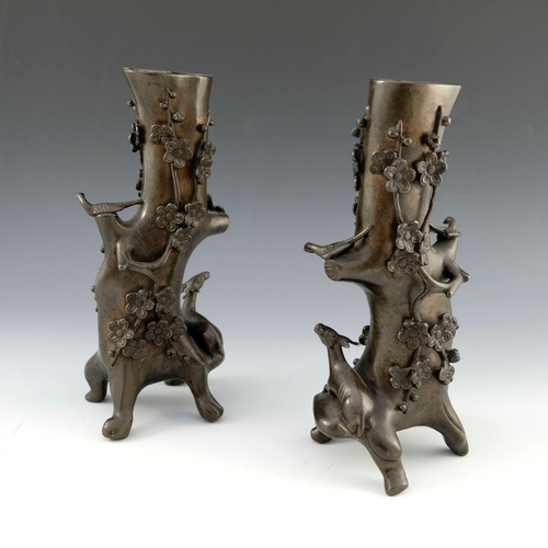 448 - A pair of Japanese bronze root vases, cast in relief with deer, birds and branches, on four feet, 26... 