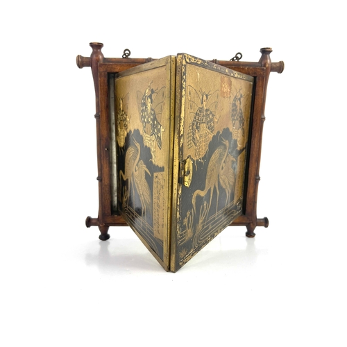 449 - A Japanese folding mirror, bamboo effect frame, the cover with cranes and foliage