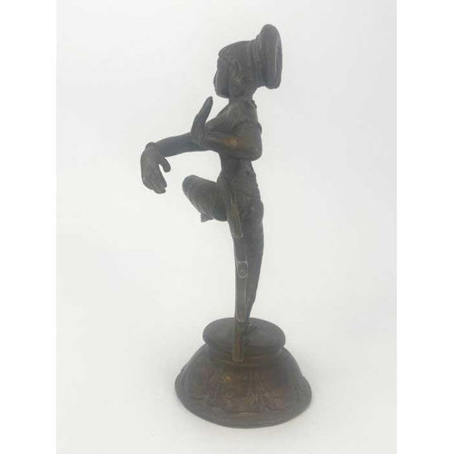 453 - A cast bronze figure of an Indian Hindu goddess Shira, modelled dancing, on cast circular base with ... 