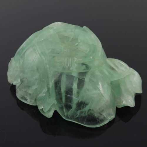 454 - A Chinese carved green quartz bowl, modelled as a leaf with lotus flowers, 14.5cm long