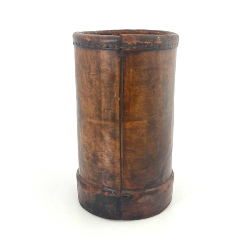 470 - A Victorian leather Cordite bucket, cylindrical form, transfer printed with the Royal coat of arms, ... 