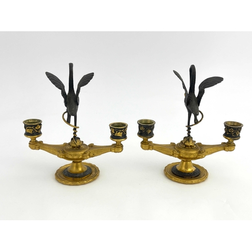 473 - Ferdinand Barbedienne, a pair of bronze and ormolu figural candelabra, modelled as twin sconced Roma... 