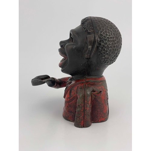 485 - A cast iron mechanical money bank, John Harper & Co, circa 1900, modelled as black man with red jack... 