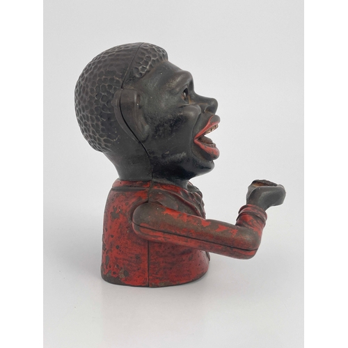 485 - A cast iron mechanical money bank, John Harper & Co, circa 1900, modelled as black man with red jack... 