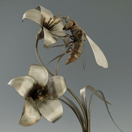 519 - Walenty Pytel (Polish, b.1941), a welded metal sculpture of a bee/wasp and flowers, on stepped base,... 