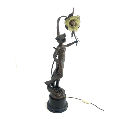 520 - Rousseau, Anemone, an Art Nouveau patinated art metal figural lamp, modelled as a maiden holding a r... 