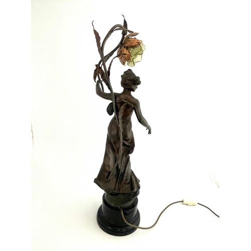 520 - Rousseau, Anemone, an Art Nouveau patinated art metal figural lamp, modelled as a maiden holding a r... 