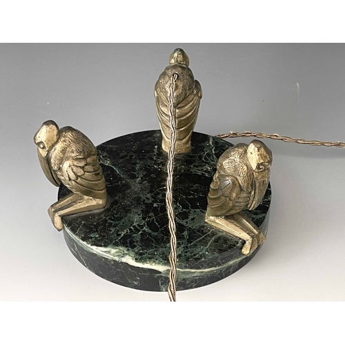 521 - An Art Deco patinated art metal and granite light fitting, circa 1930, modelled with three stylised ... 