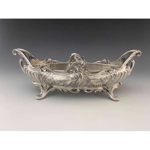 543 - A large Art Nouveau silver plated centrepiece jardiniere, twin handled boat form with metal liner, h... 