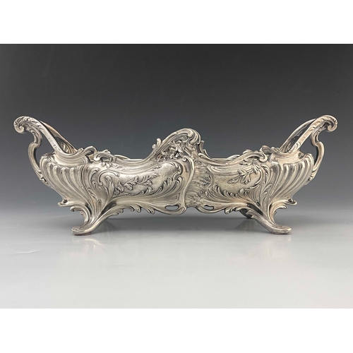 543 - A large Art Nouveau silver plated centrepiece jardiniere, twin handled boat form with metal liner, h... 