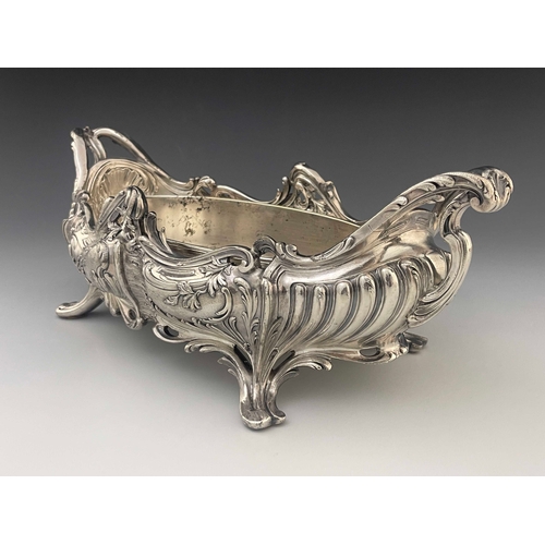 543 - A large Art Nouveau silver plated centrepiece jardiniere, twin handled boat form with metal liner, h... 