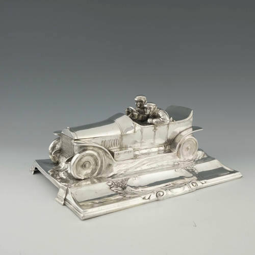 544 - WMF, a large Jugendstil silver plated desk stand, modelled as a motor car with racing drivers, scrol... 