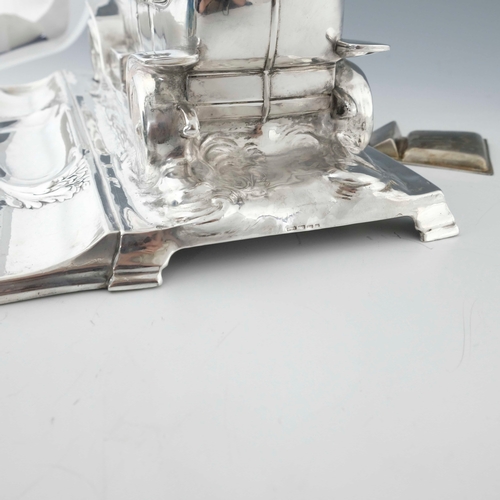 544 - WMF, a large Jugendstil silver plated desk stand, modelled as a motor car with racing drivers, scrol... 