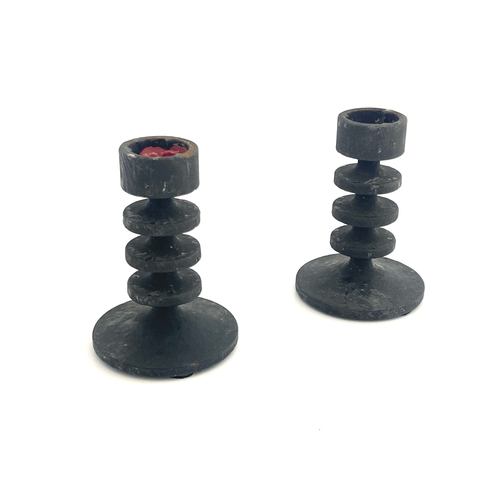 546 - Robert Welch, a pair of Campden cast iron miniature candlesticks, circa 1961, each with triple disc ... 