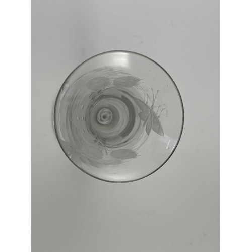 547 - A Jacobite type opaque twist wine glass, circa 1750, the flared trumpet bowl engraved with a six pet... 