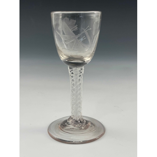 550 - A Jacobite opaque twist wine glass, circa 1765, the ovoid bowl engraved with a carnation and closed ... 