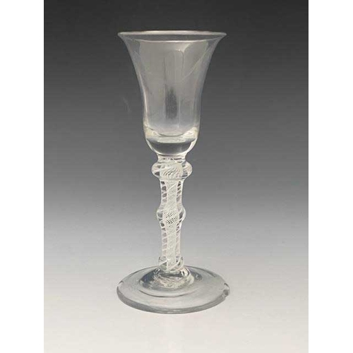 560 - A triple knopped opaque twist wine glass, circa 1765, the bell shaped bowl on a multi strand spiral ... 