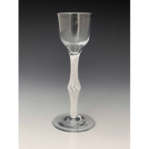 562 - An opaque twist wine glass, circa 1760, the ogee bowl on a single series multi stranded spiral knopp... 