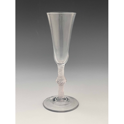 565 - An opaque twist glass flute, circa 1760, the round funnel bowl on a single series multi stranded spi... 