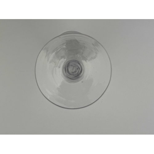 567 - An opaque twist wine glass, circa 1760, the round funnel bowl on a double series, multi stranded rib... 