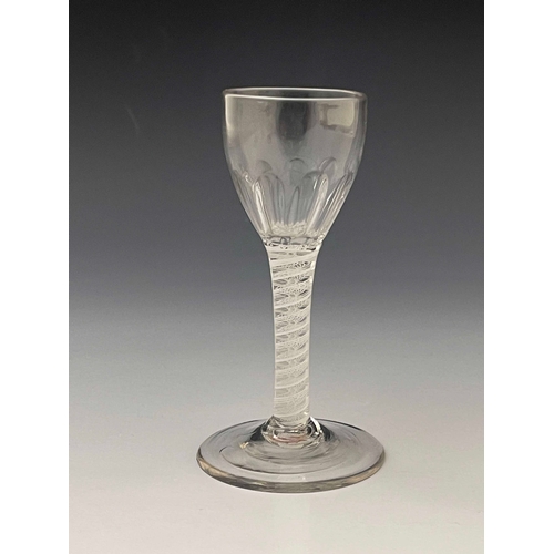 570 - An opaque twist wine glass, circa 1765, the flute moulded ovoid bowl on a double series, multi stran... 