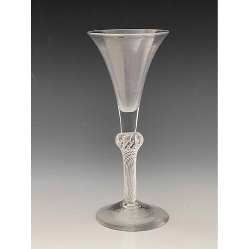 575 - A composite stem wine glass, circa 1750, the trumpet bowl on inverse baluster multi spiral air twist... 