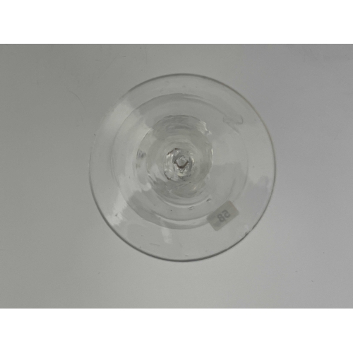 576 - A composite double knopped air twist wine glass, circa 1760, the round funnel bowl on a multi spiral... 