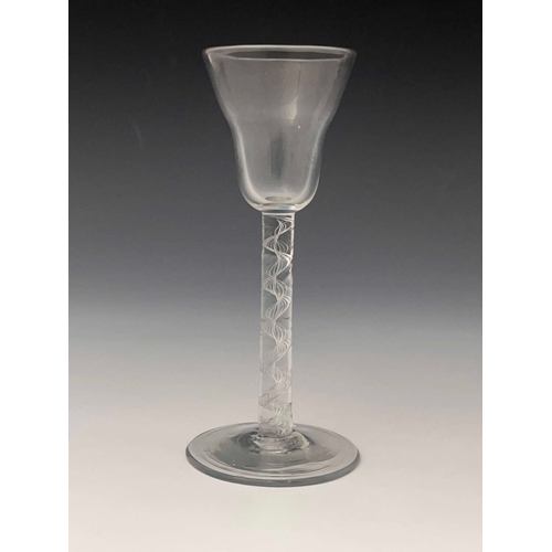 587 - An airtwist wine glass, circa 1755, the pan topped bowl on a multi strand open spiral stem, conical ... 