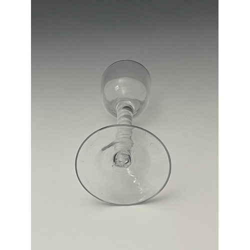 588 - An opaque twist wine glass, circa 1770, the ogee bowl on a single series corkscrew twist stem, termi... 