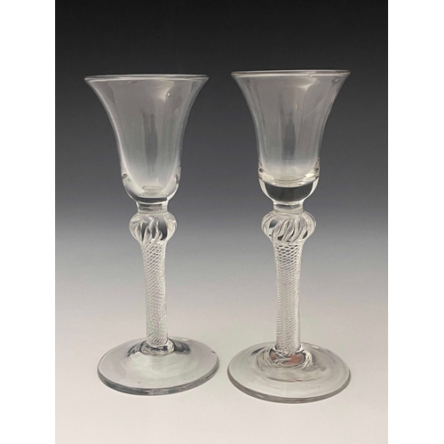 592 - A near pair of airtwist wine glasses, circa 1755, the bell shaped bowls on inverse baluster multi sp... 