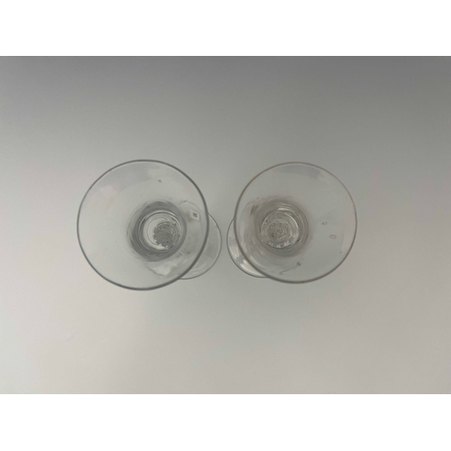 592 - A near pair of airtwist wine glasses, circa 1755, the bell shaped bowls on inverse baluster multi sp... 