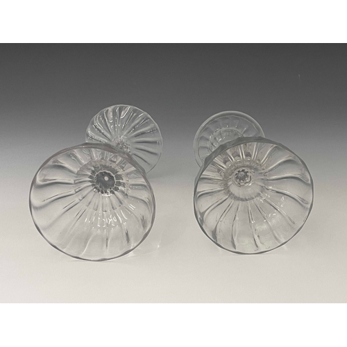 594 - Two glass optic moulded pedestal sweetmeat dishes, circa 1760, each with fluted ogee bowls, one with... 