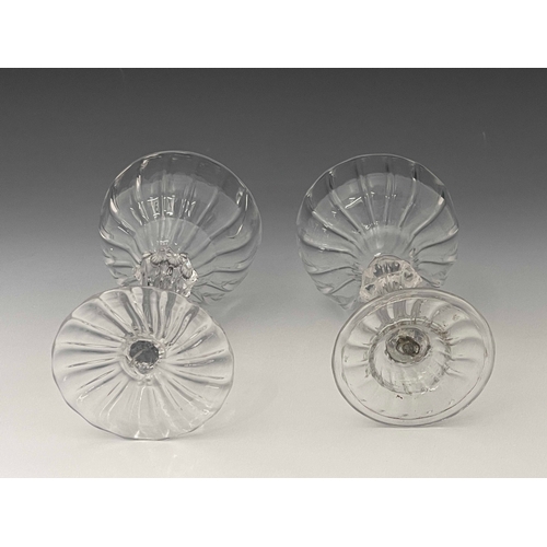 594 - Two glass optic moulded pedestal sweetmeat dishes, circa 1760, each with fluted ogee bowls, one with... 