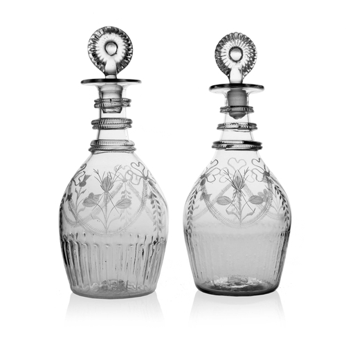 599 - A near pair of Irish glass Acts of Union decanters, probably Cork, circa 1805, Prussian form, three ... 