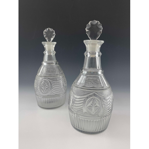 600 - A pair of Anglo Irish cut glass decanters, probably Waterford, circa 1790, tapered ovoid form, two r... 