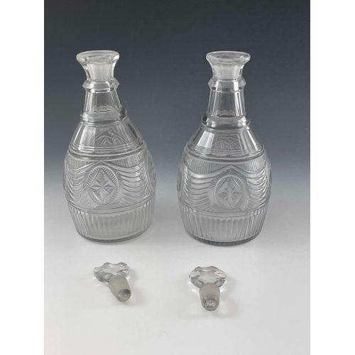 600 - A pair of Anglo Irish cut glass decanters, probably Waterford, circa 1790, tapered ovoid form, two r... 