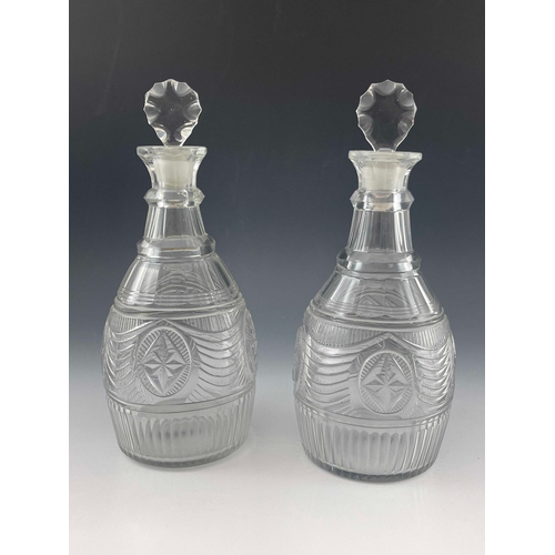 600 - A pair of Anglo Irish cut glass decanters, probably Waterford, circa 1790, tapered ovoid form, two r... 