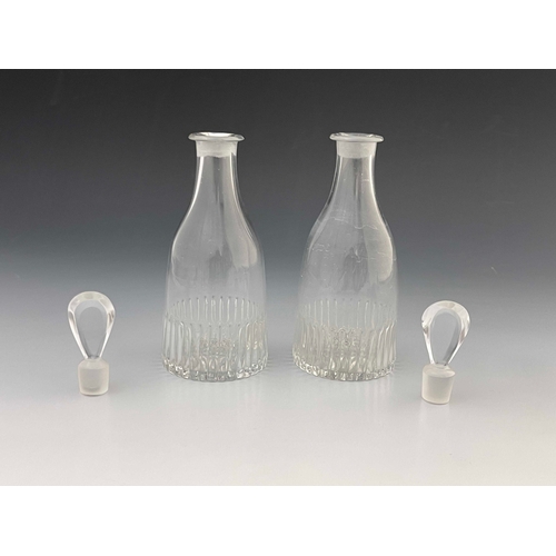 604 - A pair of Anglo Irish glass spirit decanters, circa 1775, tapered form with moulded fluting and lemo... 