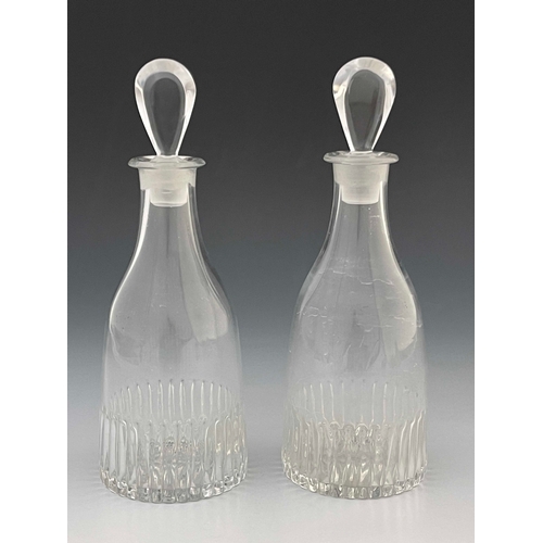 604 - A pair of Anglo Irish glass spirit decanters, circa 1775, tapered form with moulded fluting and lemo... 