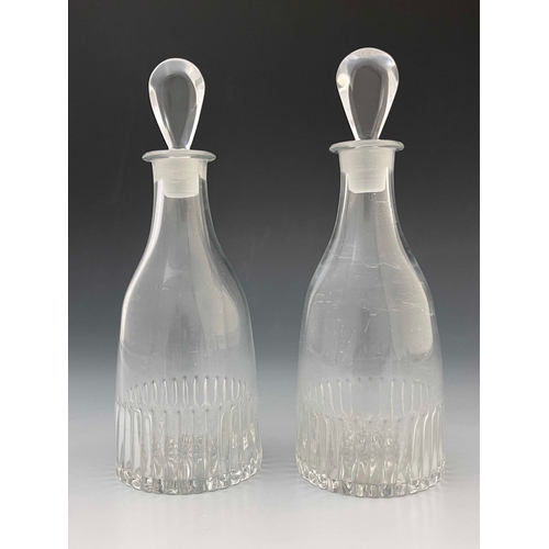 604 - A pair of Anglo Irish glass spirit decanters, circa 1775, tapered form with moulded fluting and lemo... 