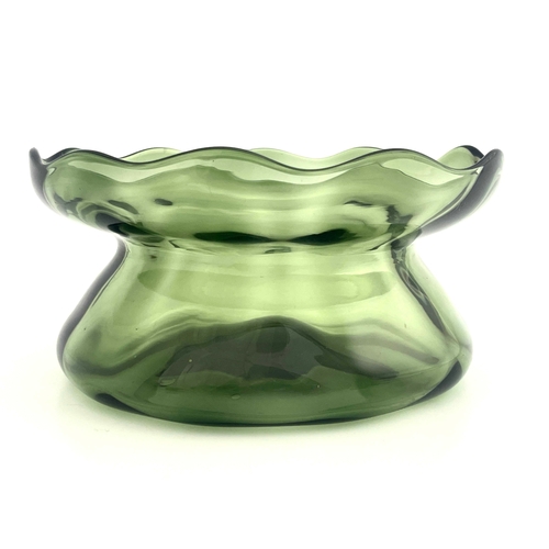 609 - Harry Powell for James Powell and Sons, Whitefriars, an Arts and Crafts green glass bowl, circa 1890... 