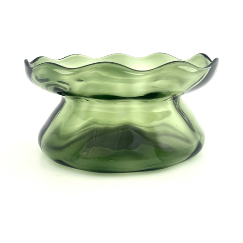 609 - Harry Powell for James Powell and Sons, Whitefriars, an Arts and Crafts green glass bowl, circa 1890... 