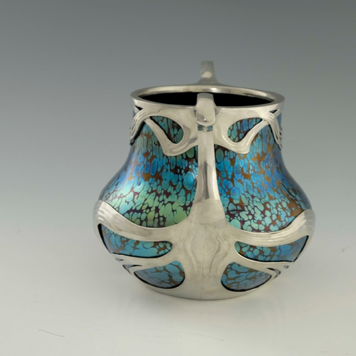 613 - Loetz, a Secessionist Rubin Papillon glass and pewter mounted twin handled vase, the iridescent spec... 