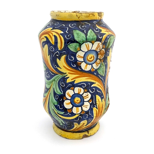 641 - An Italian Maiolica albarello pharmacy jar, probably 17th century, waisted shouldered form, polychro... 