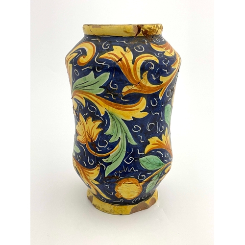 641 - An Italian Maiolica albarello pharmacy jar, probably 17th century, waisted shouldered form, polychro... 