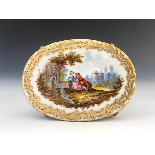 643 - A 19th century Dresden porcelain model table, the oval top painted with a Watteau type scene of a co... 