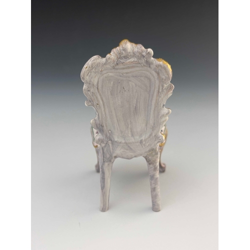 645 - Veuve Perrin (attributed), a French faience toy model of a chair, in the Louis XV style, relief mode... 